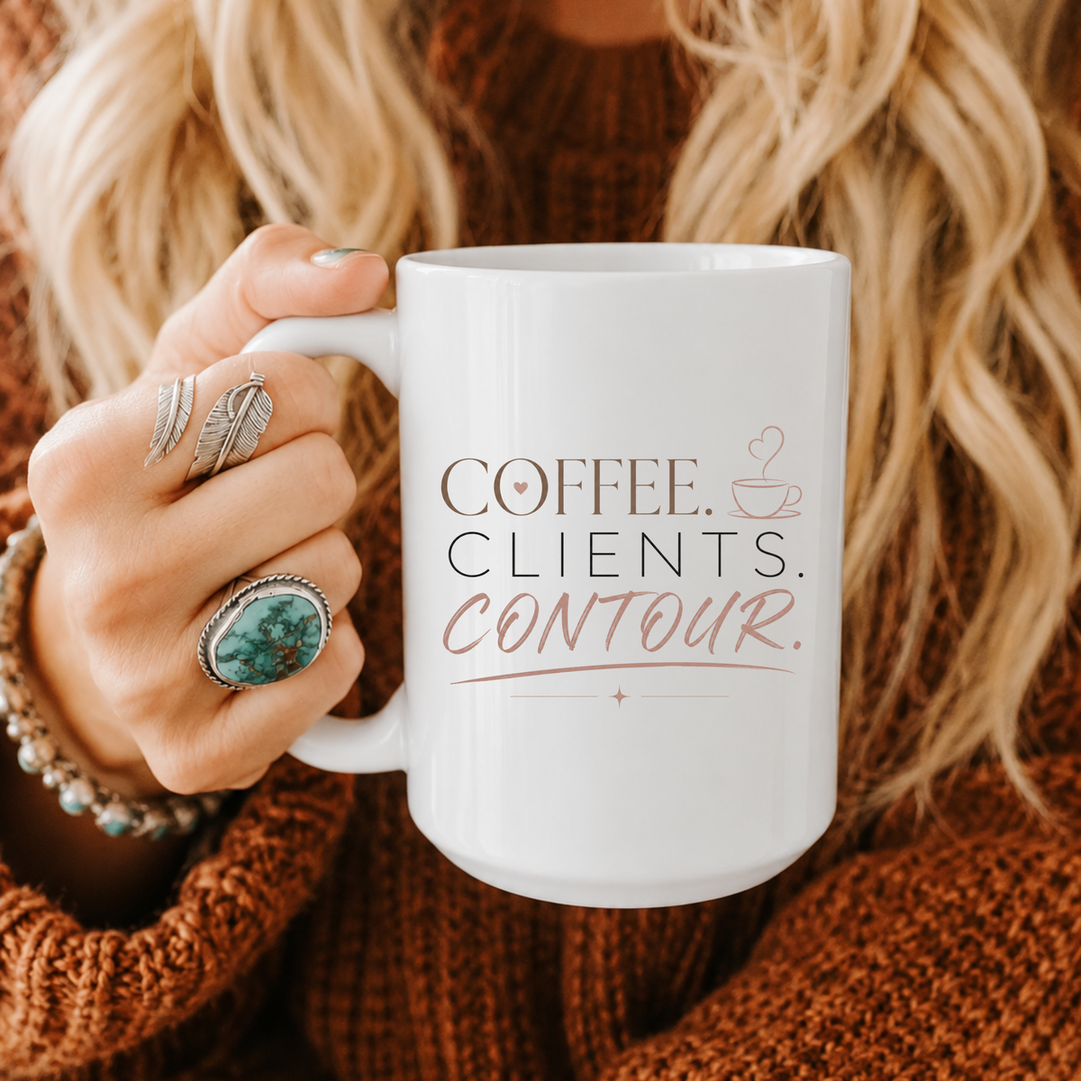 A person holding a white ceramic mug with the printed text 'COFFEE. CLIENTS. CONTOUR.' Clothing, apparel, and accessories for body contouring specialists and beauty professionals.