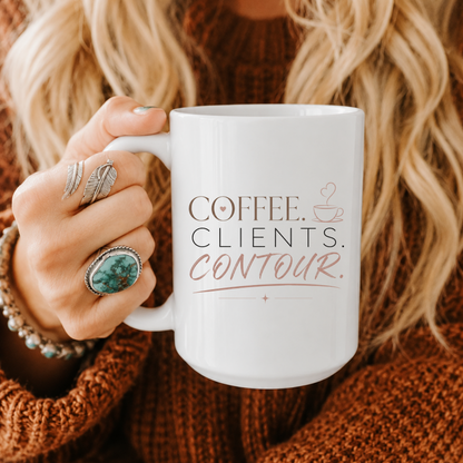 A person holding a white ceramic mug with the printed text 'COFFEE. CLIENTS. CONTOUR.' Clothing, apparel, and accessories for body contouring specialists and beauty professionals.