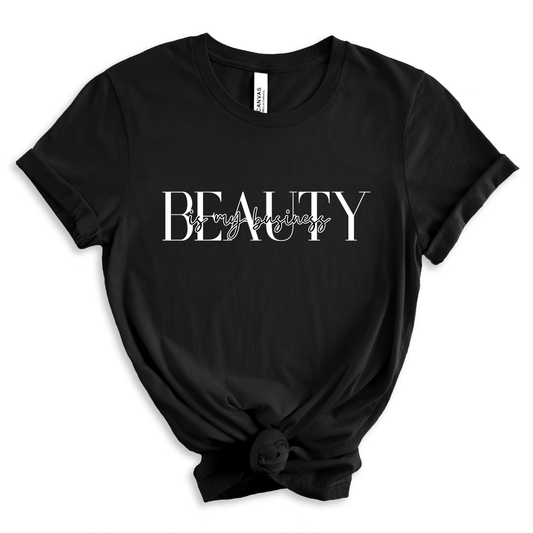 black shirt on a white solid background that says 'beauty is my business'. 